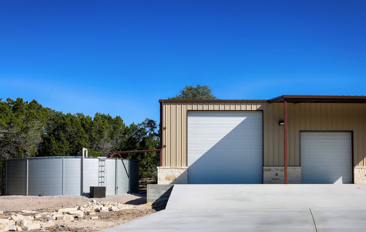 Barndominium and metal barn on rural ranch acreage
